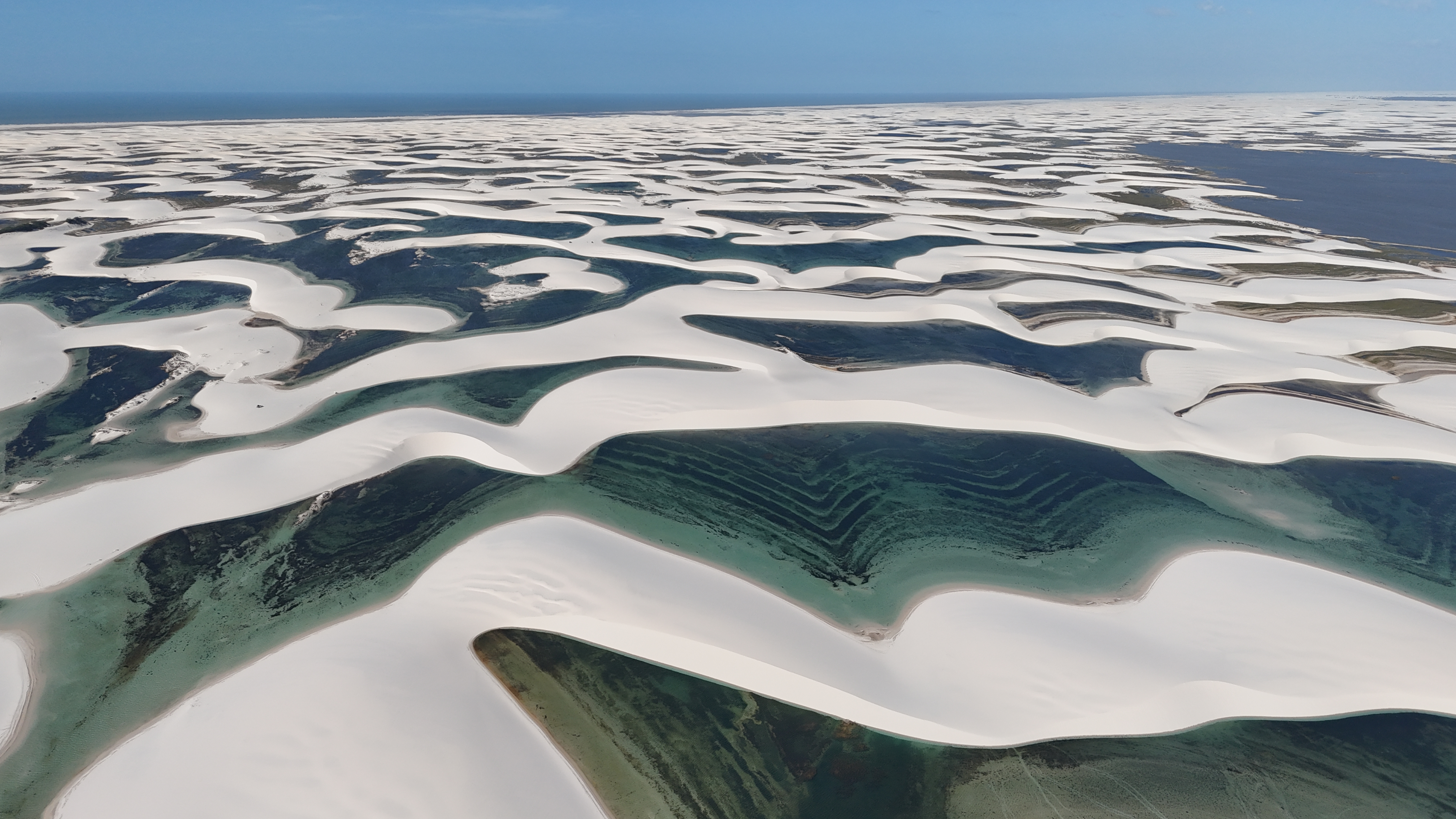 Aerial drone view of kayaks in amber water